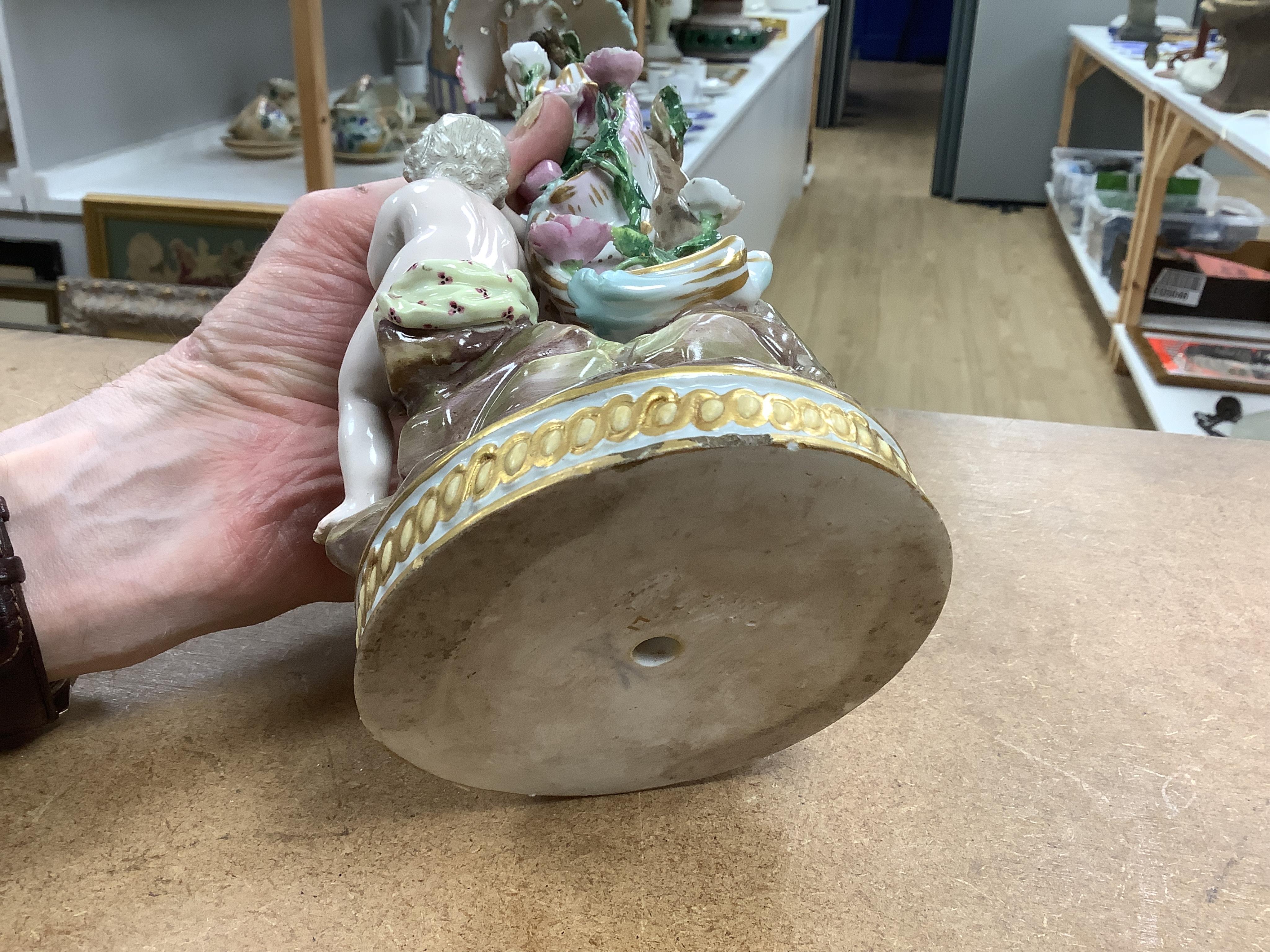 A near pair of Meissen figural candlesticks, late 19th century